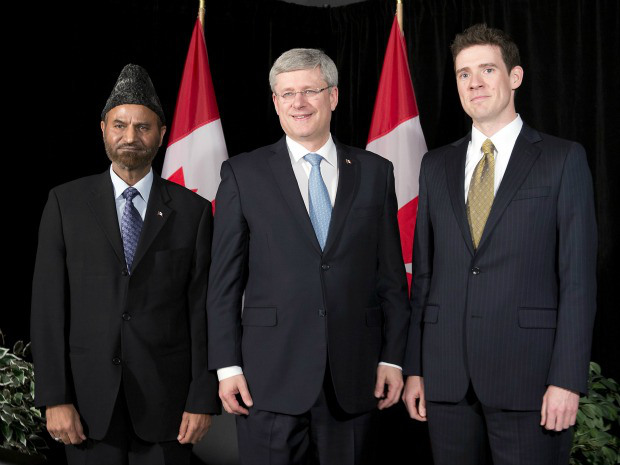 Prime Minister Stephen Harper (center) with Andrew Bennett the new Ambassador and Lal Khan Malik, National President of Ahmadiyya Muslim Community, Canada
